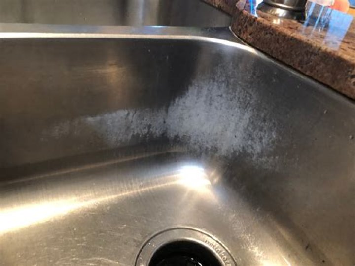 How do I care for my new stainless steel sink