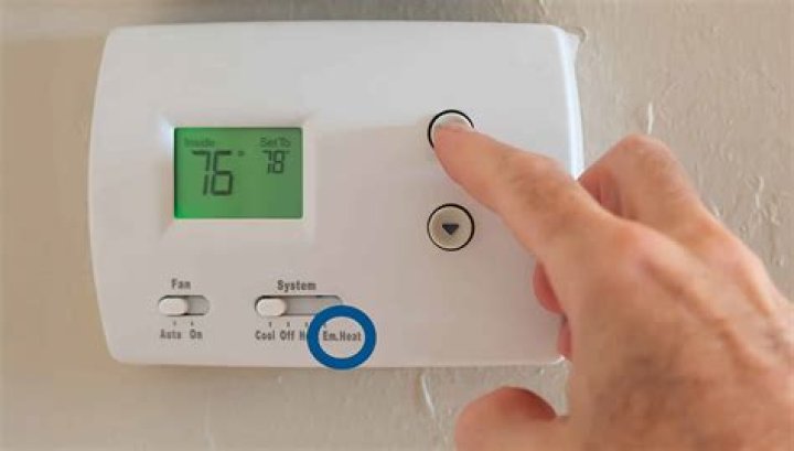 How do I set the emergency heat on my vivint thermostat