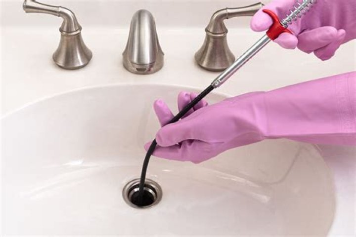 How do you clean sink mats