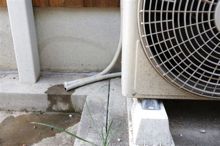 How do you drain an air conditioner drain pan