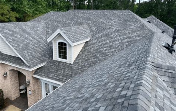 How do you glue roof shingles