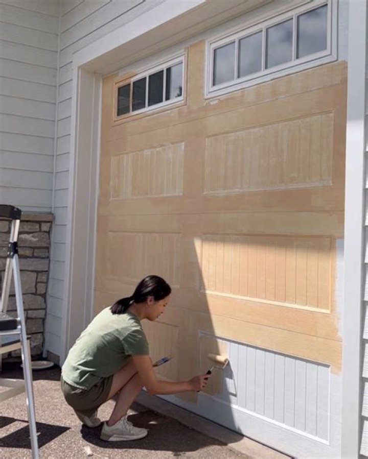 How do you maintain a wooden garage door