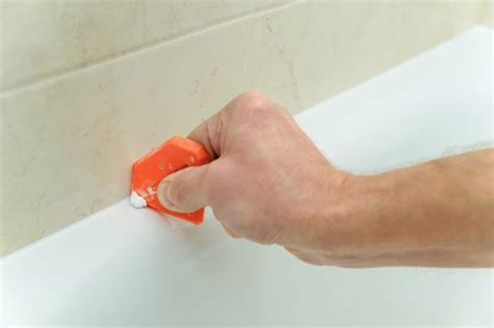 Should you caulk around tub faucet